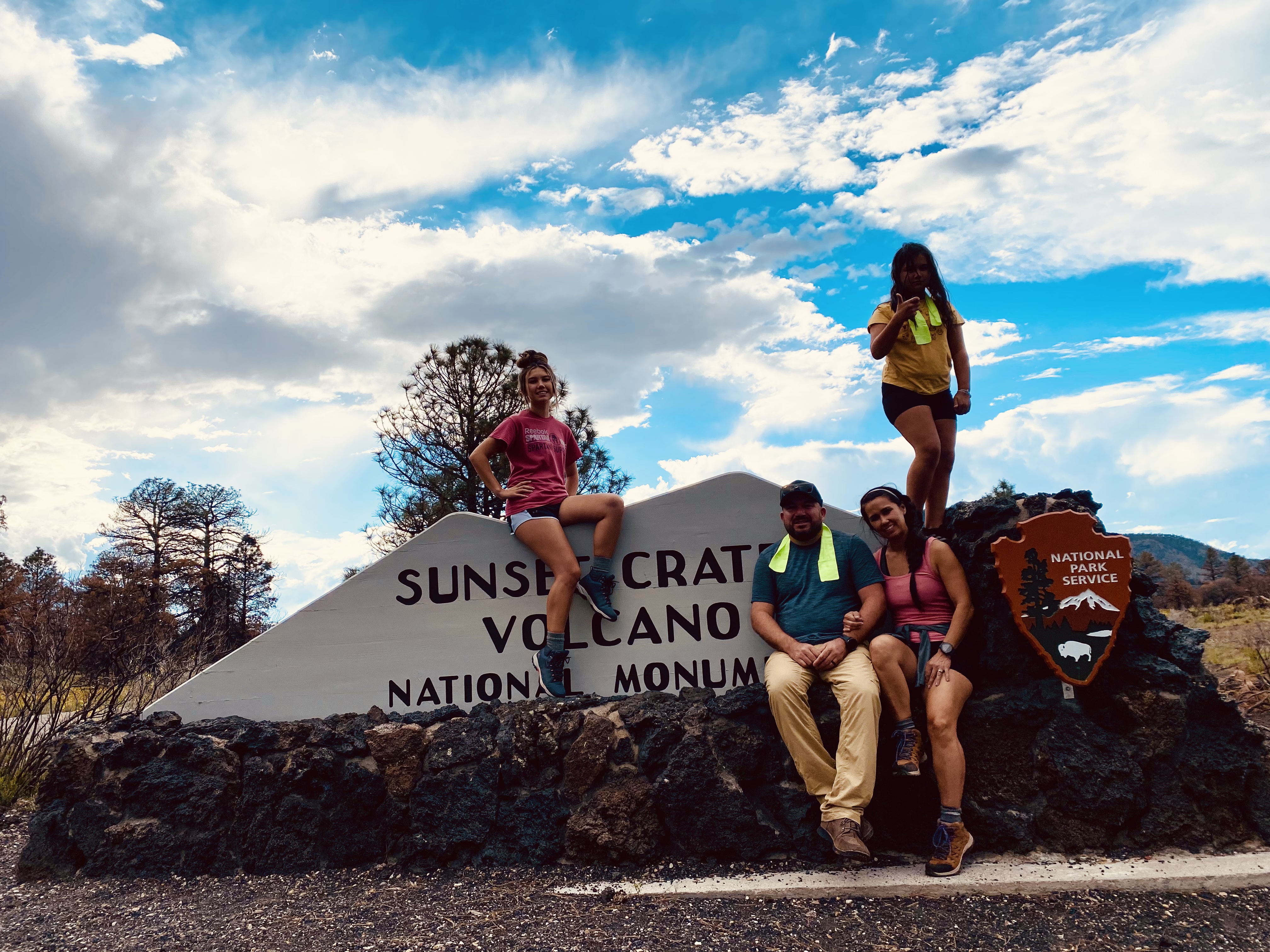 Family pic with sunset crater volcano sign