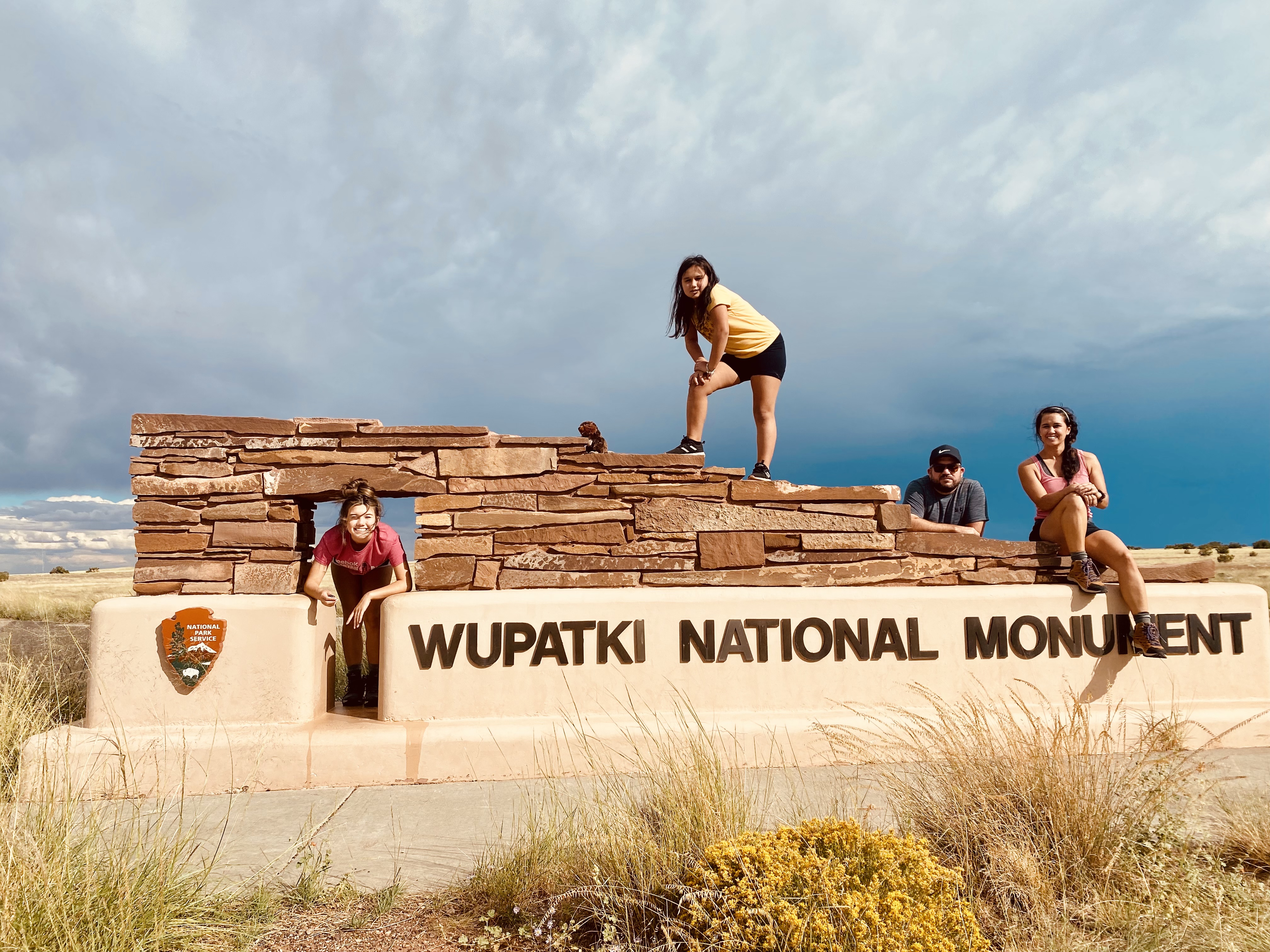Family pic with wupatki national monument sign